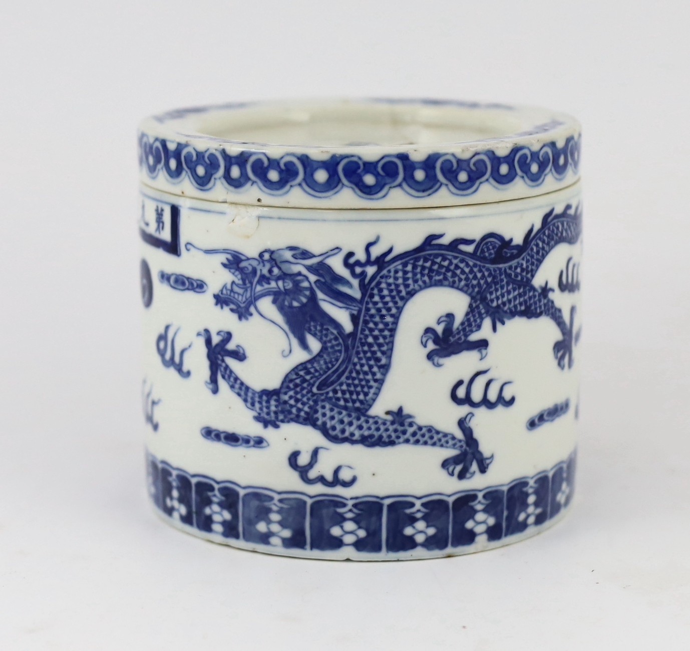 An unusual Chinese blue and white 'dragon' box and cover, 19th century, 10.5cm high, lid repaired, rim chip